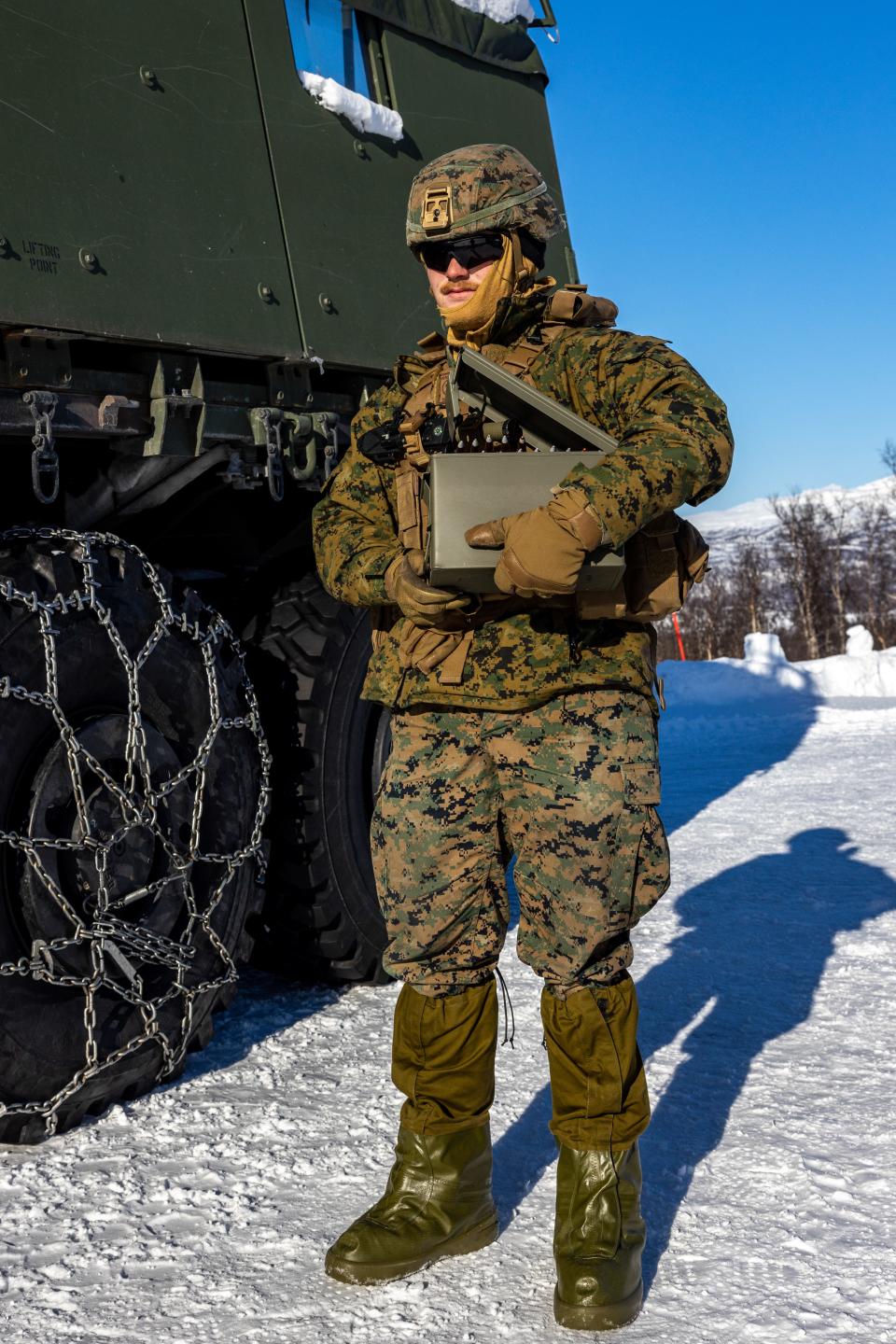 In this image from a military photo database, Tanner Kaltenberg, a motor vehicle operator with the 2nd Marine Logistics Group based in North Carolina, carries ammunition in Setermoen, Norway, on March 23, 2023. He was deployed to Norway for training. Kaltenberg, 19, of Madison, Wisconsin, was one of three Marines found dead in North Carolina after suffering carbon monoxide poisoning.