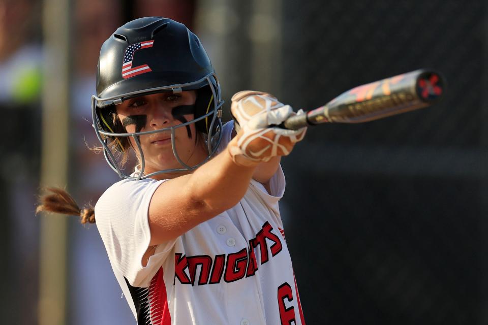 Creekside's Riley Waters (6) takes a practice swing against Providence in an April softball game.