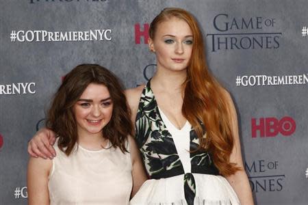 Cast members Maisie Williams and Sophie Turner arrive for the season four premiere of the HBO series "Game of Thrones" in New York March 18, 2014. REUTERS/Lucas Jackson