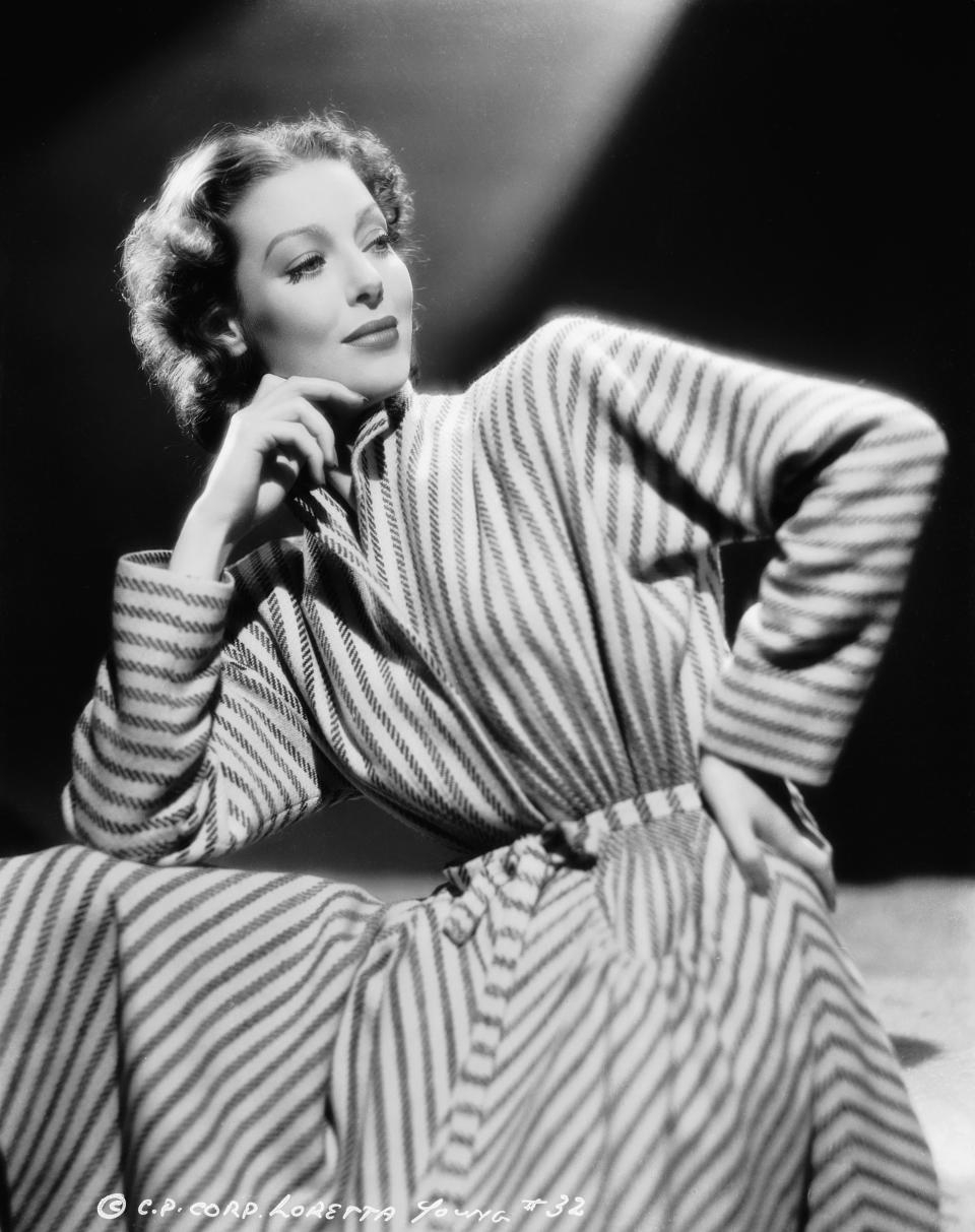 Young wears a striped robe in this image from 1940.