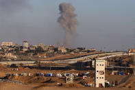 Smoke rises following an Israeli airstrike on buildings near the separating wall between Egypt and Rafah, southern Gaza Strip, Monday, May 6, 2024. (AP Photo/Ramez Habboub)