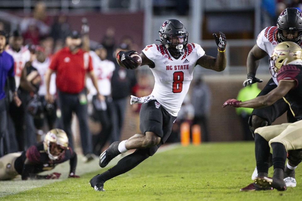 North Carolina State running back Ricky Person Jr. (8) makes a cut on his way to a touchdown during the second half of the team's NCAA college football game against Florida State in Tallahassee, Fla., Saturday, Nov. 6, 2021. N.C. State won 28-14. (AP Photo/Mark Wallheiser)