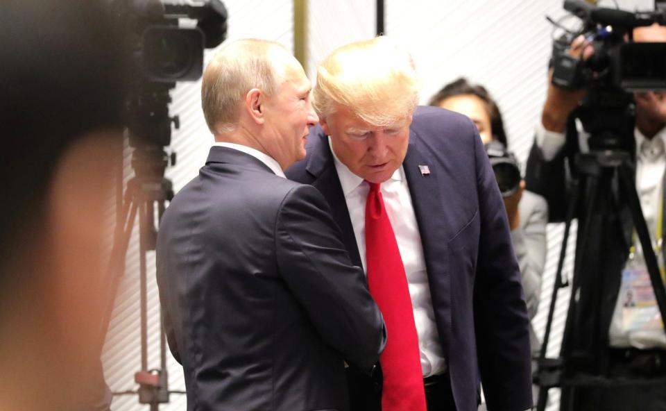Vladimir Putin tried to help Donald Trump win the White House, according to a U.S. intelligence analysis. (Photo: Russian Presidential Press and Information Office/Anadolu Agency/Getty Images)