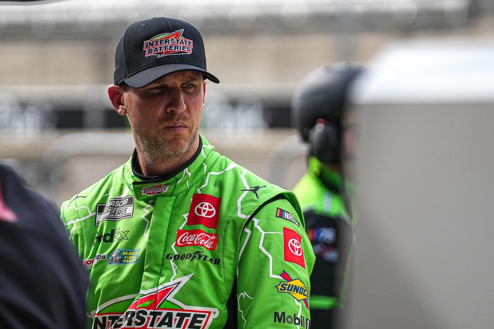 Denny Hamlin (11) walks the starting line ahead of qualifying for the Sunday NASCAR EchoPark Automotive Grand Prix at the Circuit of the Americas on Saturday, March 23, 2024 in Austin.