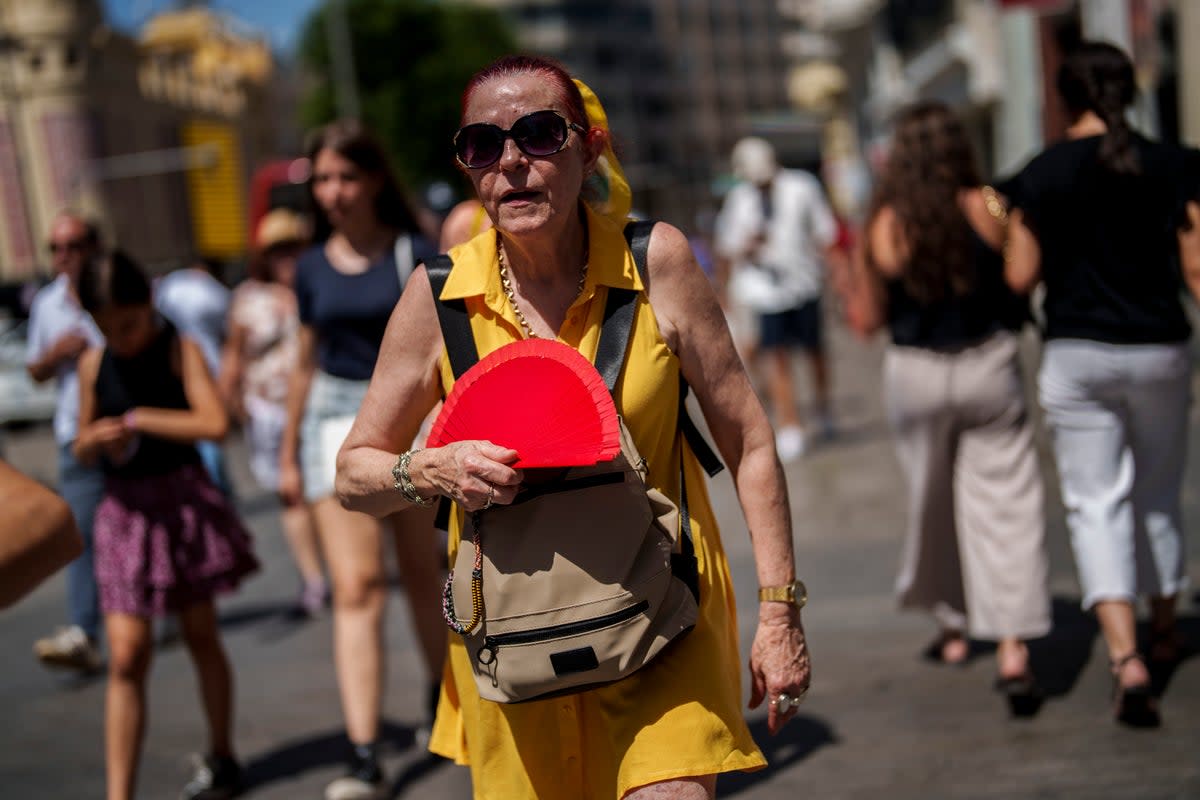 A woman fans herself in Madrid, Spain (AP)