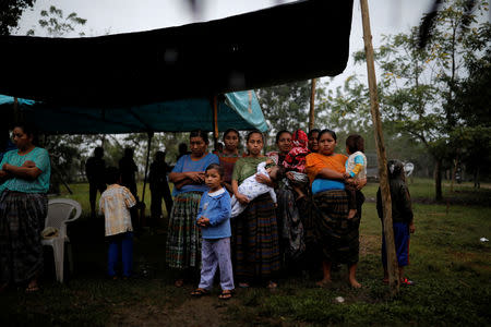 Friends and family members attend a service for Jakelin Caal, a 7-year-old girl who handed herself in to U.S. border agents earlier this month and died after developing a high fever while in the custody of U.S. Customs and Border Protection, at her home village of San Antonio Secortez, in Guatemala December 24, 2018. Picture taken December 24, 2018. REUTERS/Carlos Barria
