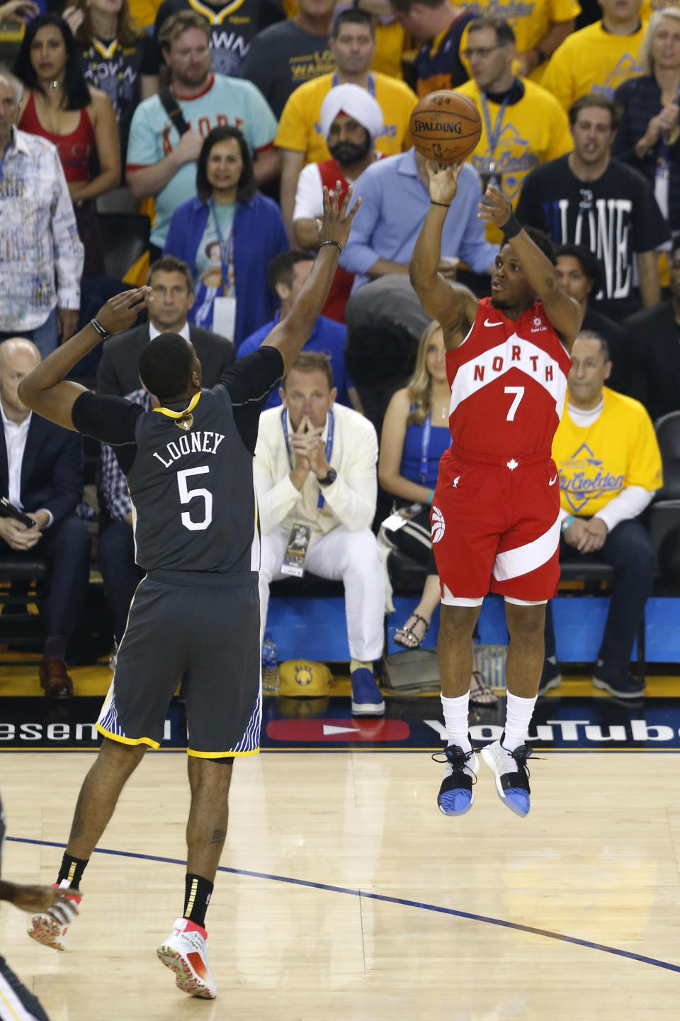 OAKLAND, CALIFORNIA - JUNE 13:  Kyle Lowry #7 of the Toronto Raptors scores a three point basket past Kevon Looney #5 of the Golden State Warriors in the first half during Game Six of the 2019 NBA Finals at ORACLE Arena on June 13, 2019 in Oakland, California. NOTE TO USER: User expressly acknowledges and agrees that, by downloading and or using this photograph, User is consenting to the terms and conditions of the Getty Images License Agreement. (Photo by Lachlan Cunningham/Getty Images)