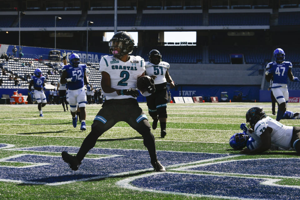 Coastal Carolina running back Reese White (2) scores a touchdown during the first half of an NCAA football game against Georgia State, Saturday, Oct. 31, 2020, in Atlanta. (AP Photo/John Amis)
