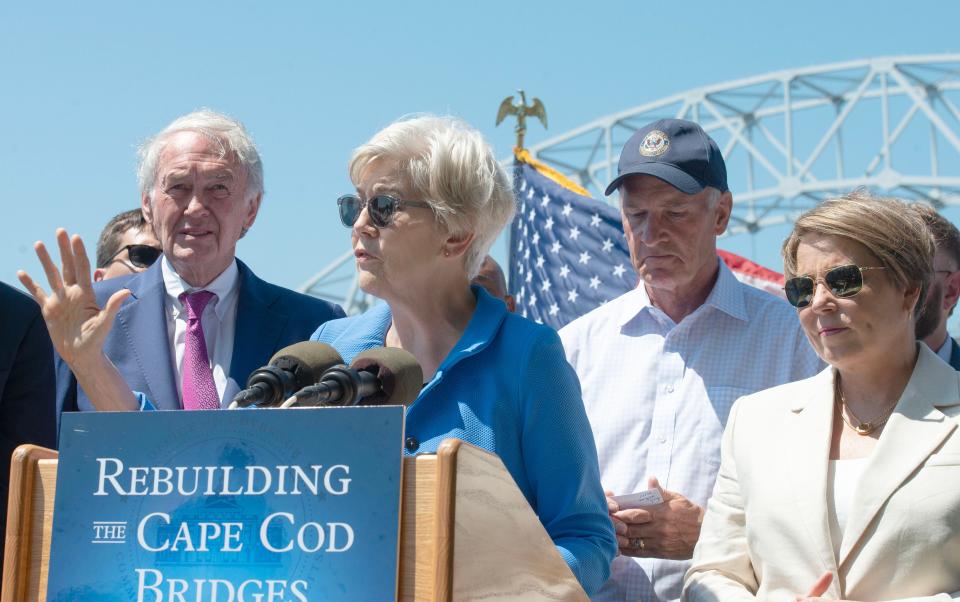 U.S. Sen. Elizabeth Warren, D-Massachusetts, is flanked by U.S. Sen. Edward Markey, D-Massachusetts, left, U.S. Rep. William Keating, D-Massachusetts, and Gov. Maura Healey on Tuesday during a press conference along the Cape Cod Canal against a backdrop of the Sagamore Bridge. Officials highlighted the recent funding that will now allow the bridge replacement to move forward.