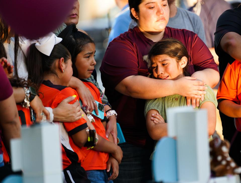 Mourners pay their respects on May 27, 2022, at a memorial for the children and teachers killed at Robb Elementary School in Uvalde, Texas, on May 24, 2022.