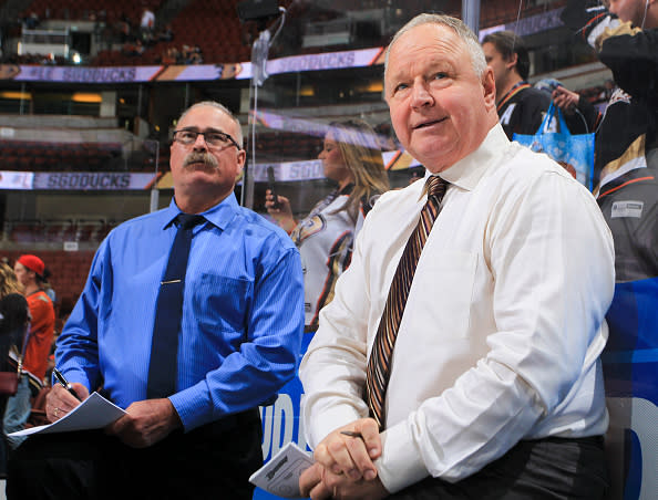 Randy Carlyle and assistant coach Paul MacLean of the Anaheim Ducks watch warmup before the game against the New Jersey Devils at Honda Center on November 17, 2016 in Anaheim, California. (Photo by Debora Robinson/NHLI via Getty Images)