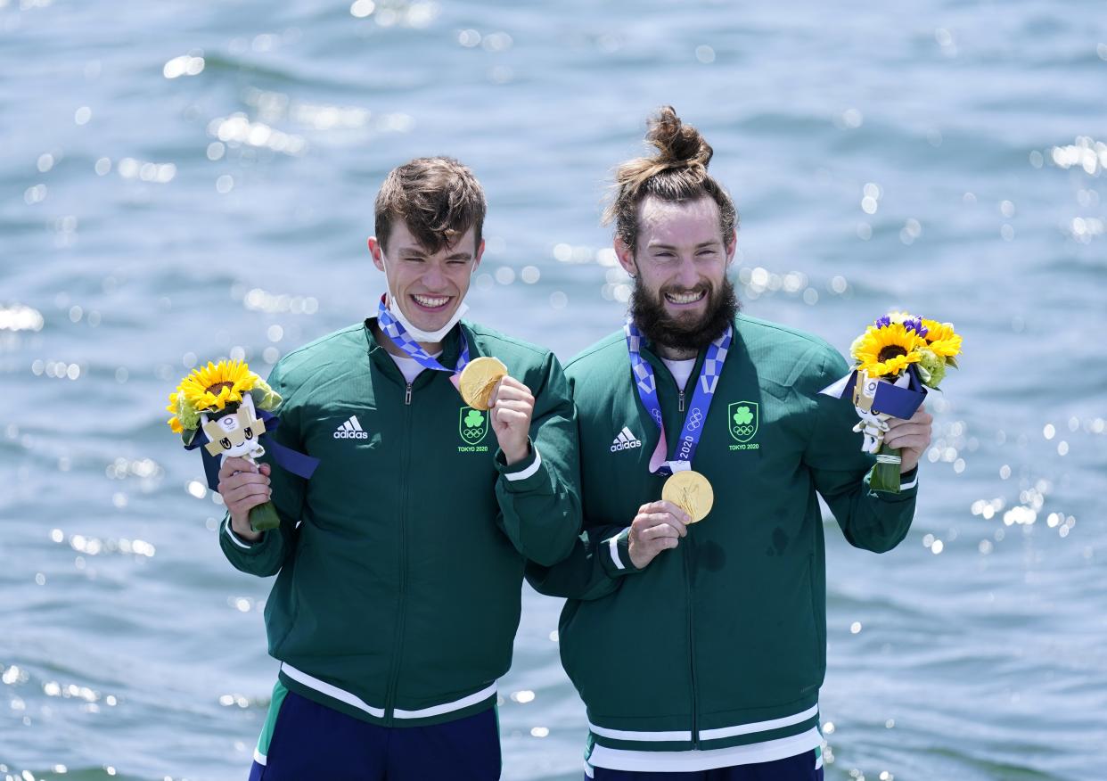 Fintan McCarthy and Paul O’Donovan on the podium following their Olympic win (Danny Lawson/PA) (PA Wire)