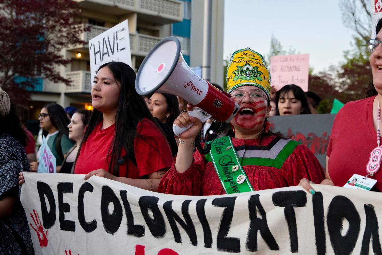 Angela Noah chants alongside a group of marchers representing the Native Student Union and Indigenous WomenÕs and Marginalized Genders Wellness Group at Take Back the Night Thursday, April 27, 2023. The 45th annual event was hosted by the UO WomenÕs Center to recognize and support survivors of sexual assault, abuse and violence