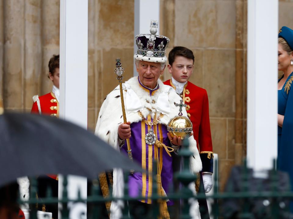 King Charles III departs the coronation service on May 6, 2023