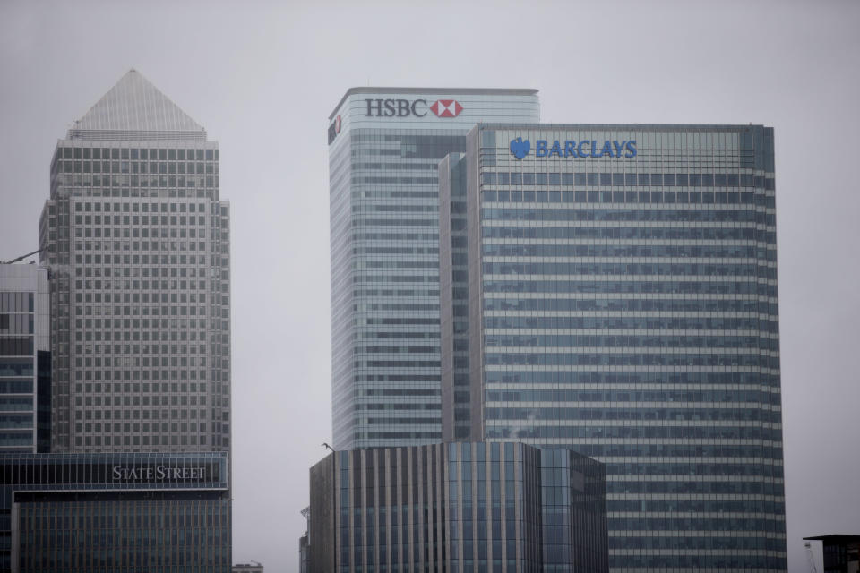 fAn exterior view shows the headquarters building of Barclays Bank, 1 Churchill Place, at right, in the Canary Wharf business district of London, Thursday, May 8, 2014.  British bank Barclays says it will cut around 14,000 jobs this year as it looks to streamline its operations and reduce the size of its investment banking arm.  The figure was higher than anticipated — previously the bank had indicated that it was looking to get rid of between 10,000 and 12,000 people.  (AP Photo/Matt Dunham)