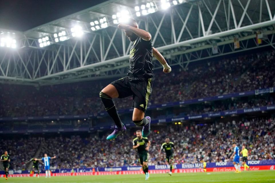 Real Madrid’s Karim Benzema celebrates after scoring his side’s third goal at Espanyol (Joan Mateu Parra/AP) (AP)