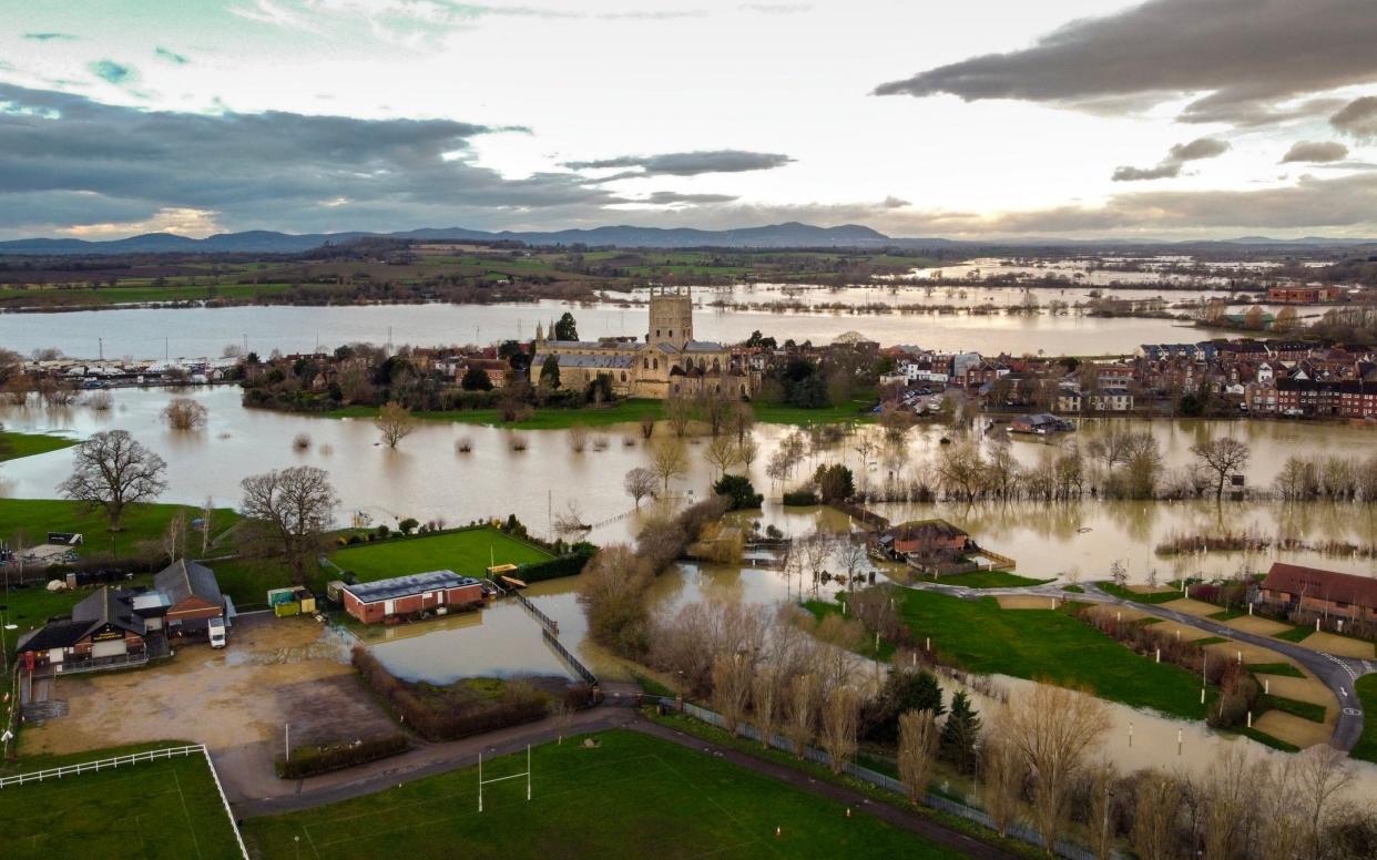 Tewkesbury Abbey surrounded by floodwater during heavy rainfall at the start of 2024