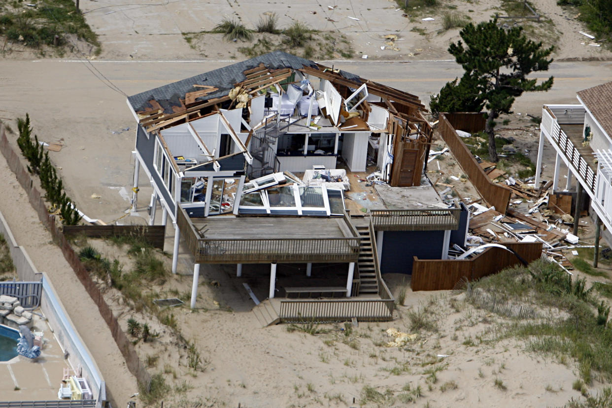 This aerial photo taken Sunday, Aug. 28, 2011 shows damage to a home in Virginia Beach, Va., after a reported tornado, spurned by Hurricane Irene, ripped through the area Saturday. (AP Photo/The Virginian-Pilot, Amanda Lucier)