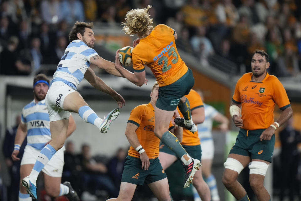 Australia's Carter Gordon and Argentina's Nicolas Sanchez, left, compete for the ball during the Rugby Championship test match between Australia and Argentina in Sydney, Australia, Saturday, July 15, 2023. (AP Photo/Rick Rycroft)