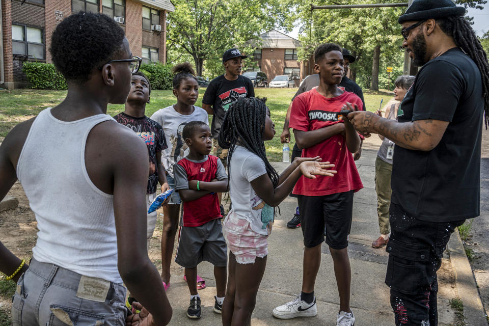 Hambino Godbody talks with kids from the Cumberland View projects where he grew up in Nashville, Tenn., on July 28, 2021. (John Partipilo / AP file)