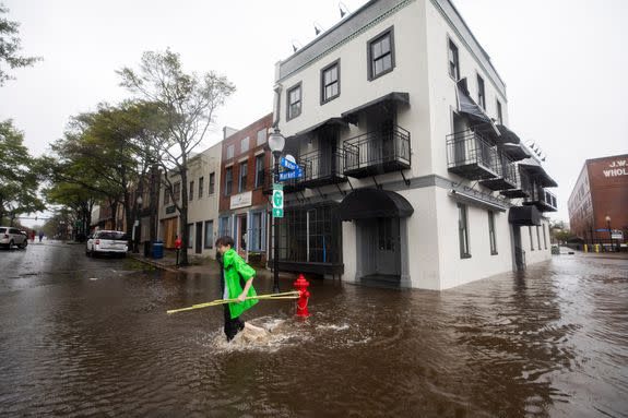 Sam Parks walks through flooded Water Street as Hurricane Florence comes ashore in Wilmington, North Carolina