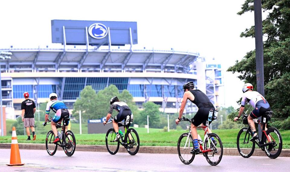 Participants in the Ironman 70.3 Pennsylvania Happy Valley bike toward Beaver Stadium on Sunday, July 2, 2023. Steve Manuel/For the CDT
