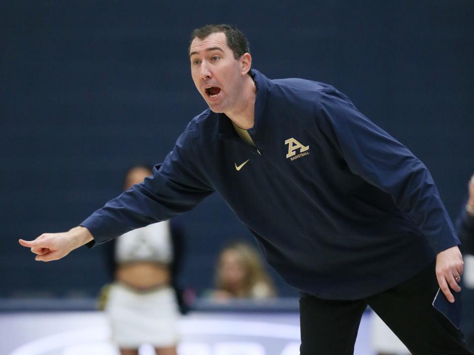 Akron's Head Coach Ryan Gensler directs his team in the first half of the game against Kent State at University of Akron's James A. Rhodes Arena on Saturday Jan. 20, 2024 in Akron.