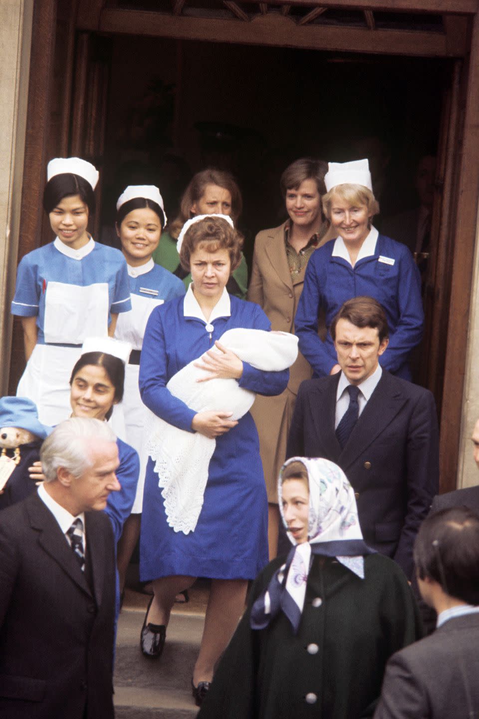 <p>Royal moms might give birth in hospitals these days (the Lindo Wing is a particular fave), but they're still wildly obsessed with midwives - even when doctors, nurses, and a special royal gynecologist are on hand. </p><p>It's <a rel="nofollow noopener" href="https://www.cheatsheet.com/health-fitness/unusual-royal-baby-traditions-you-had-no-idea-existed.html/?a=viewall" target="_blank" data-ylk="slk:traditional;elm:context_link;itc:0;sec:content-canvas" class="link ">traditional</a> for members of the family to have midwives by their side for labor and delivery (<a rel="nofollow noopener" href="http://www.dailymail.co.uk/news/article-3065678/Call-midwives-calm-duo-delivered-Princess.html" target="_blank" data-ylk="slk:Kate had three;elm:context_link;itc:0;sec:content-canvas" class="link ">Kate had three</a>!), and <a rel="nofollow noopener" href="https://www.telegraph.co.uk/news/2016/05/24/doctor-reveals-23-strong-team-behind-birth-of-princess-charlotte/" target="_blank" data-ylk="slk:apparently;elm:context_link;itc:0;sec:content-canvas" class="link ">apparently</a> they're sworn to secrecy. Here's Princess Anne leaving the Lindo Wing with her son Peter, flanked by a veritable army of people who helped out during the big moment. FYI, Anne set the royal trend of giving birth at the Lindo Wing, and was followed by Diana and Kate.</p>