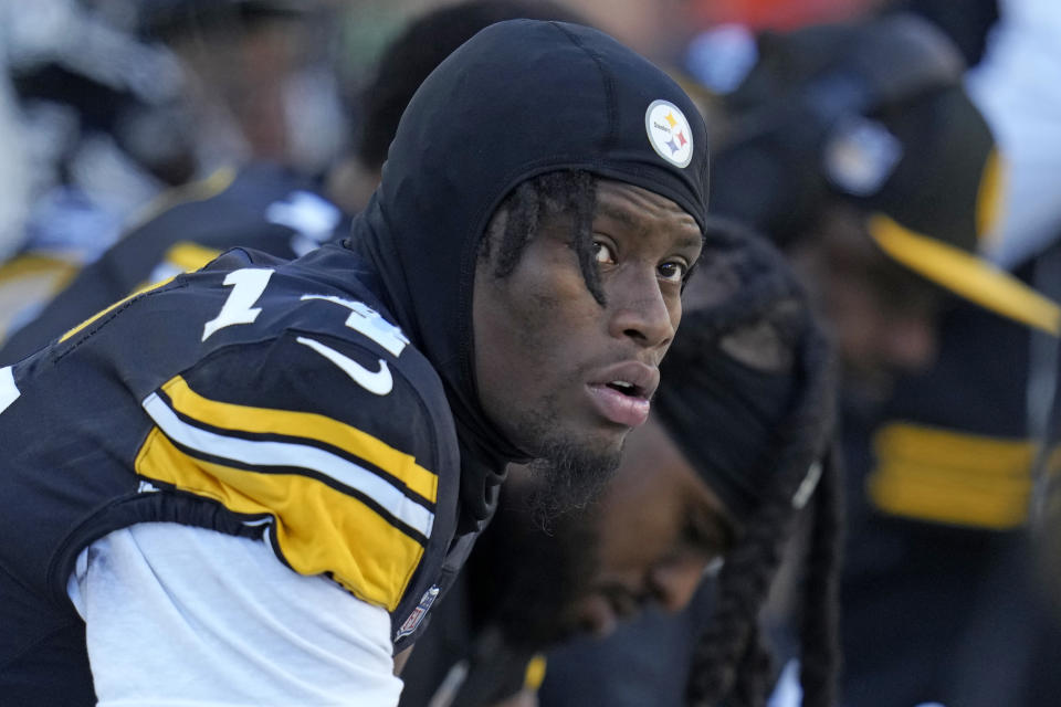Pittsburgh Steelers wide receiver George Pickens, left, sits on the bench next to wide receiver Diontae Johnson during an NFL football game against the Green Bay Packers in Pittsburgh, Sunday, Nov. 12, 2023. (AP Photo/Gene J. Puskar)