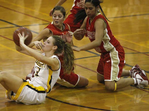 Jude Memorial girls basketball players during a 2011-12 game — Deseret News