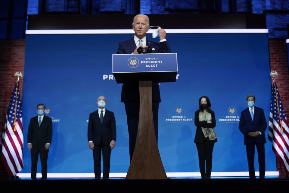 President-elect Joe Biden removes his face mask as he arrives to introduce his nominees and appointees to key national security and foreign policy posts at The Queen theater, Tuesday, Nov. 24, 2020, in Wilmington, Del. President-elect Joe Biden’s first wave of Cabinet picks and choices for his White House staff have prized staying power over star power, with a premium placed on government experience and proficiency as he looks to rebuild a depleted and demoralized federal bureaucracy.(AP Photo/Carolyn Kaster)