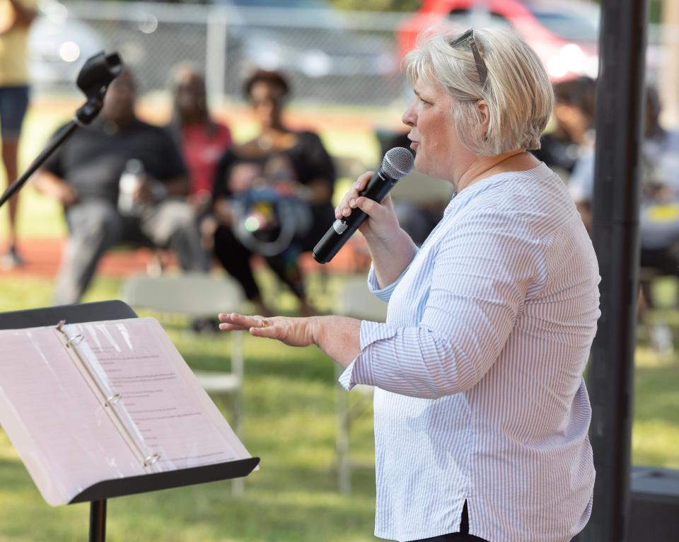 Beth Lechner, executive director at Habitat for Humanity East Central Ohio, speaks at the Southeast Community Playground Habitat for Humanity dedication celebration in Canton.