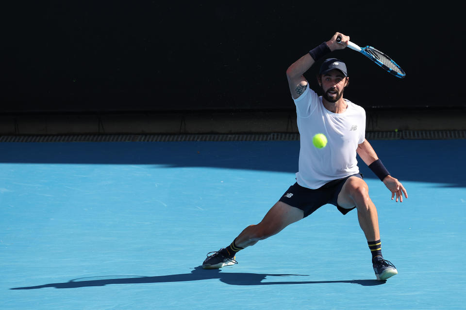 Jordan Thompson hits a forehand.