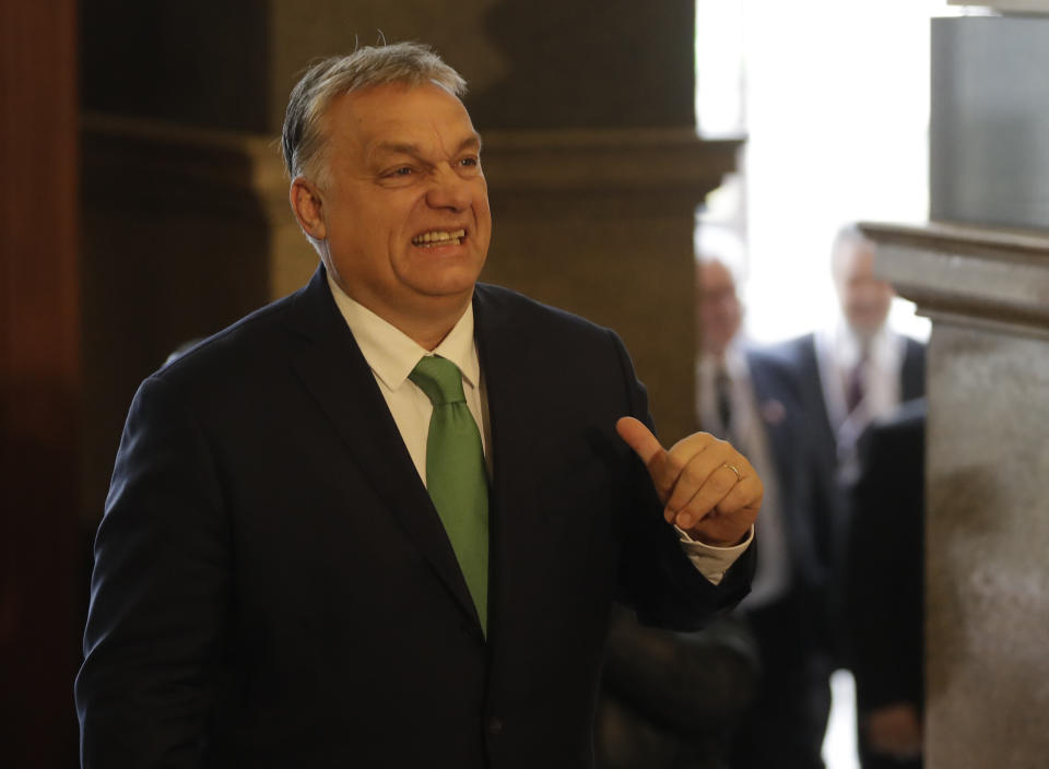 Prime Minister of Hungary Viktor Orban grimaces as he arrives to meet with his V4 counterparts at the National Museum in Prague, Czech Republic, Thursday, Jan. 16, 2020. (AP Photo/Petr David Josek)