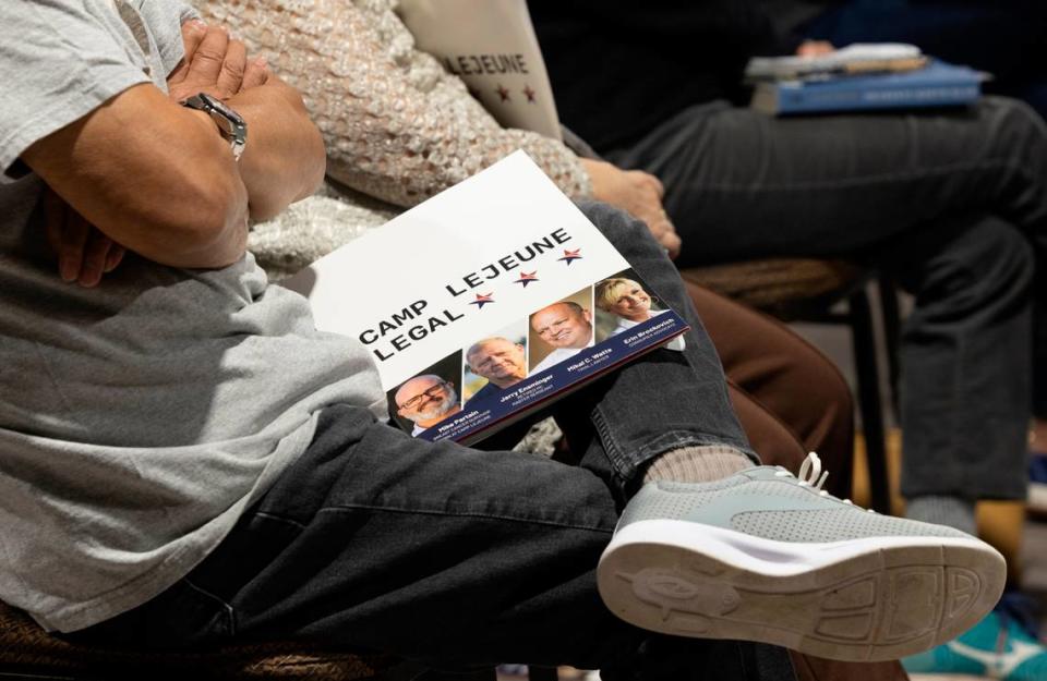 Members of the audience hold information packets as they listen to speakers during a series of town halls in cities across the United States in Raleigh, Nov. 4, 2022.