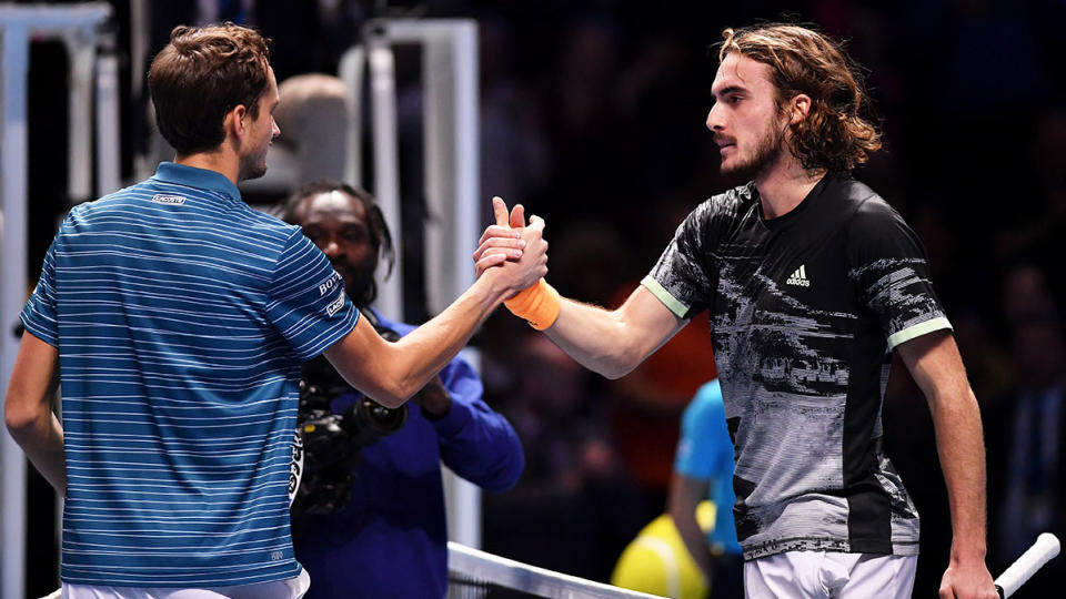 Daniil Medvedev of Russia shakes hands at the net with Stefanos Tsitsipas of Greece after their singles match during Day Two of the Nitto ATP World Tour Finals at The O2 Arena on November 11, 2019 in London, England. (Photo by Justin Setterfield/Getty Images)