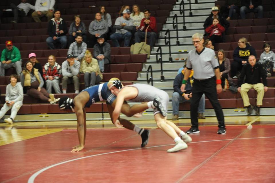 State College’s Xavier Zeruth looks to finish off a takedown of Cedar Cliff’s William White in their 172-pound match of the Little Lions’ 34-32 win on Thursday at State College. Zeruth pinned White in 1:59.