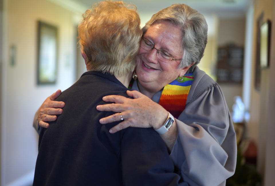 The Rev. Linda Barnes Popham, right, hugs a member of Fern Creek Baptist Church after a service, Sunday, May 21, 2023, in Louisville, Ky. In February, Fern Creek was one of five churches disfellowshipped from the Southern Baptist Convention because they have female pastors. But Fern Creek and Saddleback Church of California have decided to appeal. The challenge will be voted on at the upcoming SBC annual meeting. (AP Photo/Jessie Wardarski)