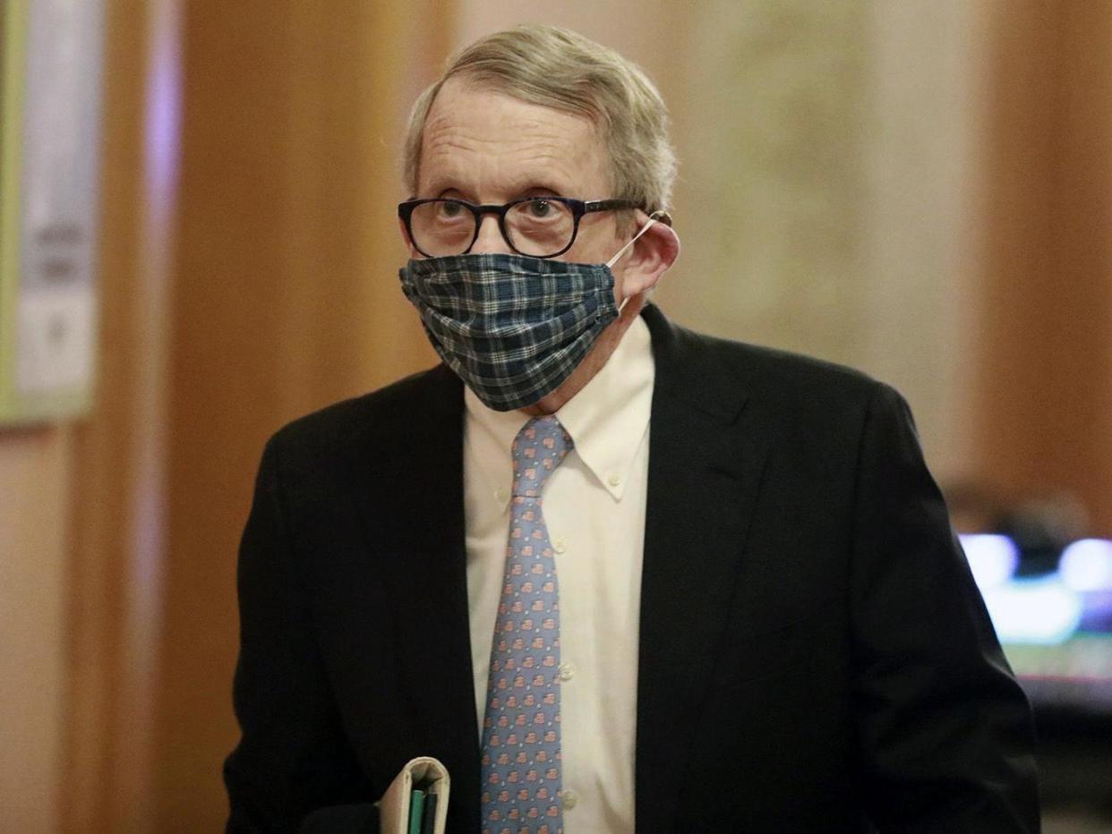 Ohio governor Mike DeWine wears a face masks on his way to news conference in Columbus, Ohio, on 16 April, 2020: Doral Chenoweth/The Columbus Dispatch via AP