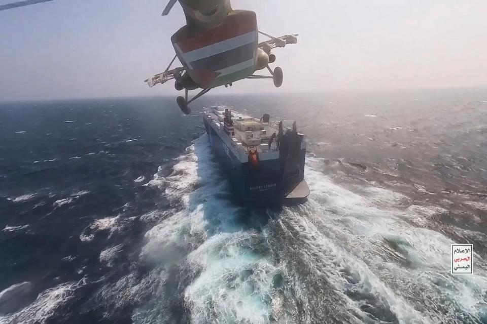 A Houthi helicopter approaching the cargo ship Galaxy Leader on Nov. 19, 2023. (Houthi Media Center/The Associated Press - image credit)