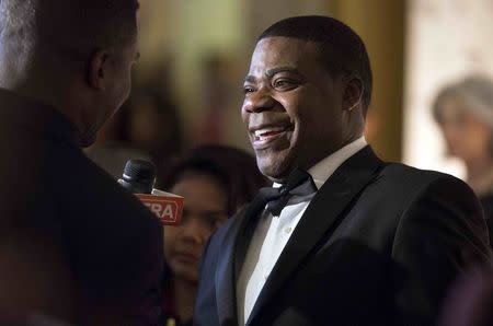 Comedian Tracy Morgan smiles as he speaks to a reporter as he arrives for the Mark Twain prize for Humor honoring Eddie Murphy at the Kennedy Center in Washington in this October 18, 2015 file photo. REUTERS/Joshua Roberts/Files