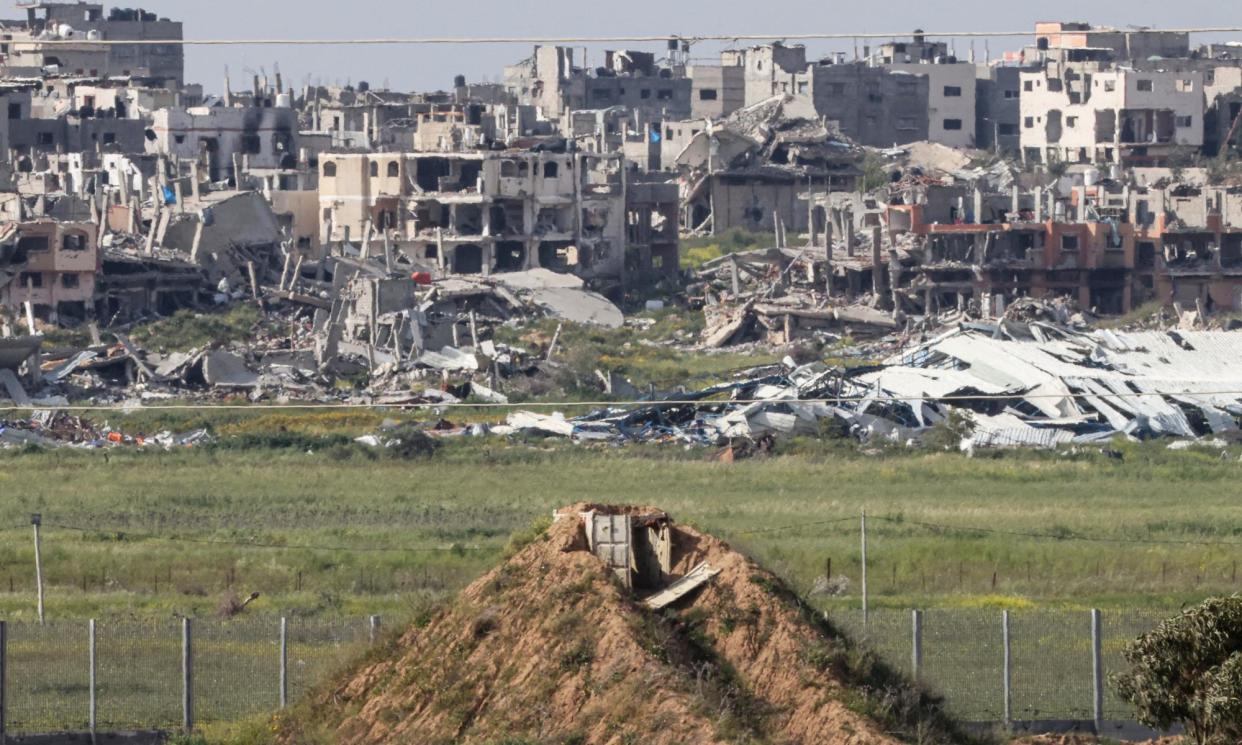 <span>Picture taken from Israel's southern border with the Gaza Strip shows buildings destroyed by Israeli bombardment on Tuesday.</span><span>Photograph: Jack Guez/AFP/Getty Images</span>
