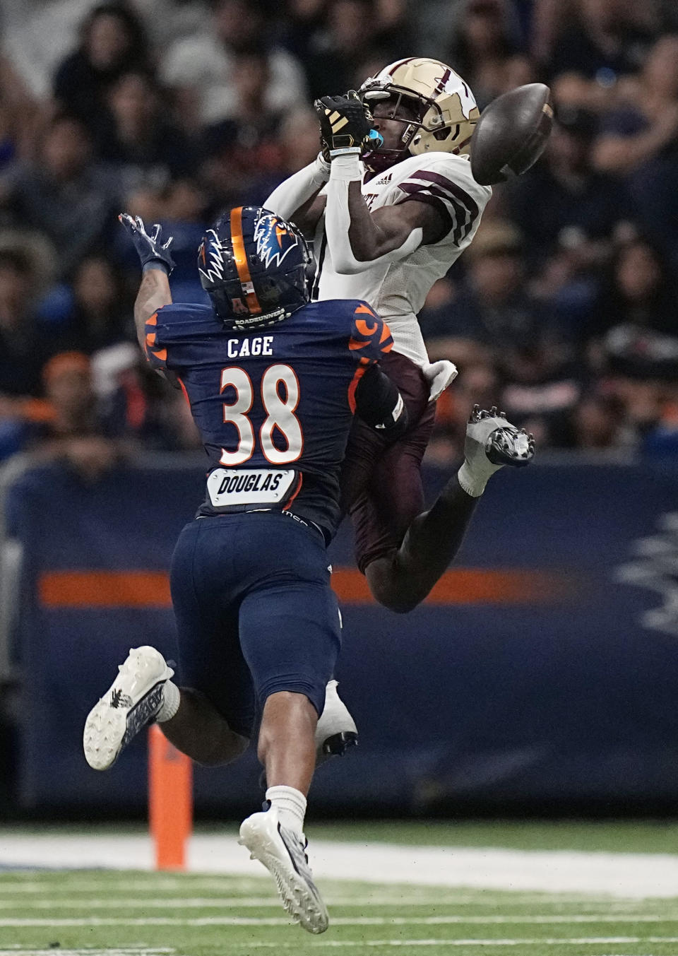 UTSA linebacker Pig Cage (38) breaks up a pass intended for Texas State wide receiver Ashtyn Hawkins (1) during the second half of an NCAA college football game, Saturday, Sept. 9, 2023, in San Antonio. (AP Photo/Eric Gay)