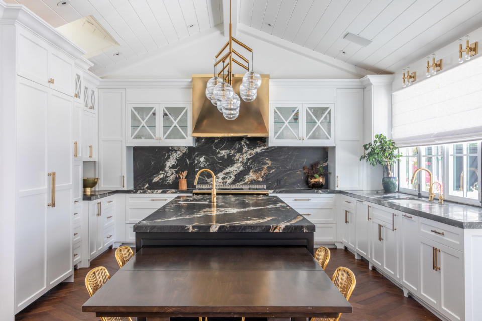 Modern white kitchen with two-tier island