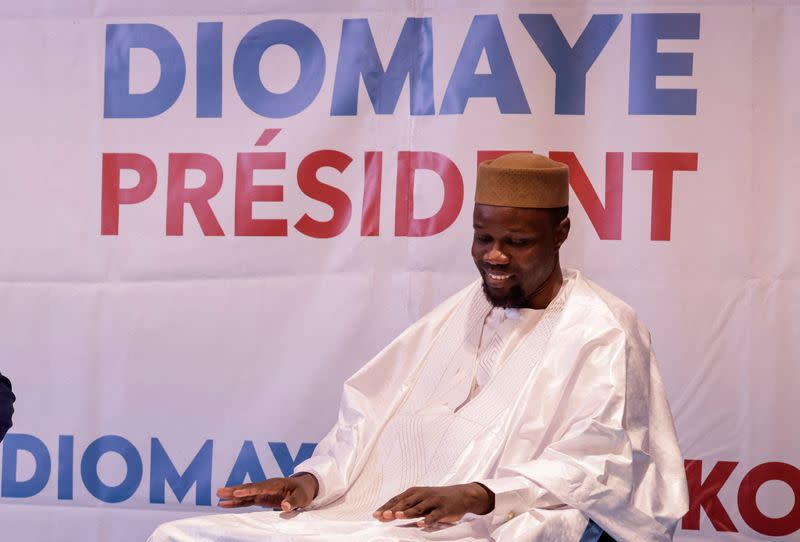 FILE PHOTO: Senegalese opposition leader Ousmane Sonko smiles during a joint press conference in Dakar