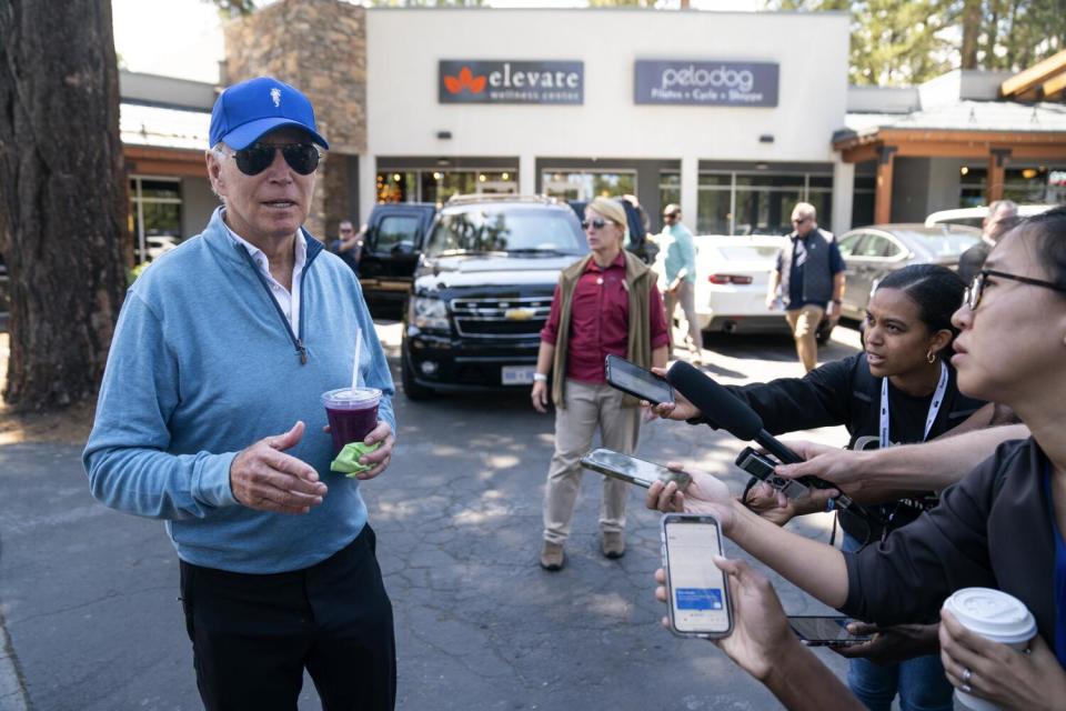 President Joe Biden speaks with reporters.