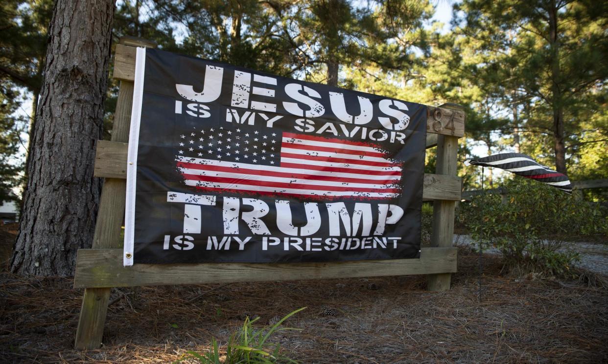 <span>An evangelical Trump supporter’s banner, displayed outside rural Georgia home.</span><span>Photograph: Robin Rayne/Zuma/Rex/Shutterstock</span>