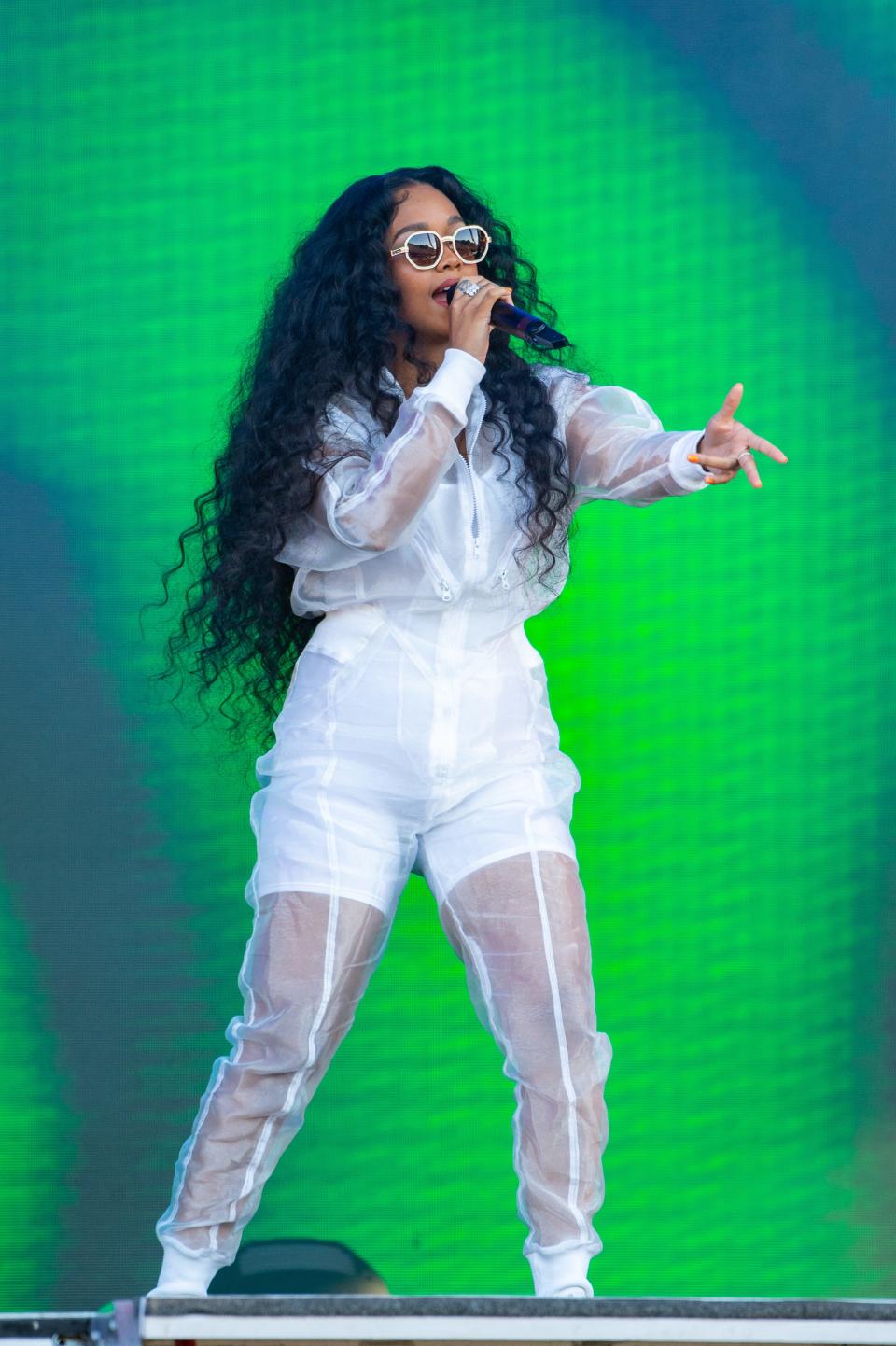 H.E.R. performs in a sheer white jumpsuit at Wireless Festival