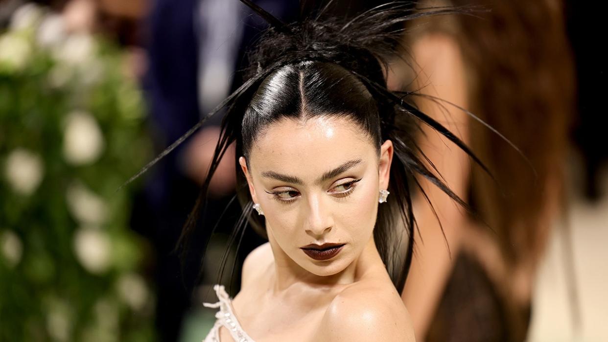 A close up photo of Charli XCX at the Met Gala 2024