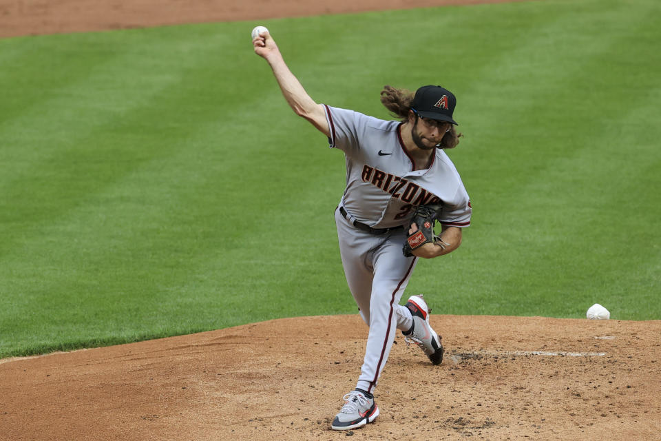 Arizona Diamondbacks' Zac Gallen throws during the first inning of the team's baseball game against the Cincinnati Reds in Cincinnati, Tuesday, April 20, 2021. (AP Photo/Aaron Doster)